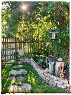 an outdoor garden with stones and plants