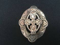 Old brooch probably made of old costume pieces, executed in silver. The brooch does not have a silver label but has been tested. Check out all my jewelry for man or woman on the link below. https://www.etsy.com/nl/shop/BeautifulVintage4You?section_id=32347405 Because all my items are vintage, it means they are old and original and can have signs of age. View all photos carefully and ask all the questions you have. On request, we would like to send more pictures. 🌷Thanks to the visit and enjoy o Ornate Oval Engraved Brooches, Traditional Hallmarked Brooch For Formal Occasions, Antique Hallmarked Brooches For Ceremonial Occasions, Ornate Pendant Brooch For Ceremonial Occasions, Ornate Engraved Brooch, Victorian Hallmarked Brooches For Ceremonial Use, Antique Brooches With Intricate Design For Ceremonial Use, Antique Ceremonial Brooches With Intricate Design, Traditional Engraved Brooches For Gift