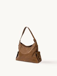 The Small Yore Hobo Bag Timeless Brown Shoulder Bag With Handle Drop, Timeless Brown Hobo Bag With Top Handle, Timeless Brown Hobo Shoulder Bag, Cognac Soft Leather Shoulder Bag For Everyday Luxury, Everyday Luxury Textured Leather Tote Shoulder Bag, Daily Leather-lined Satchel Hobo Bag, Leather Lined Satchel Hobo Bag, Timeless Satchel Hobo Bag, Brown Tote Shoulder Bag For Everyday Luxury