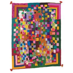 a multicolored patchwork quilt with fringes on the edges and squares in different colors