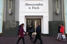 people walking in front of abercrombie and fitch store