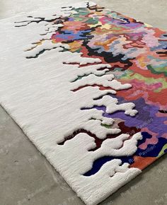 a multicolored area rug on the floor