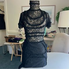 Beautiful Designer Black Lace Short-Sleeve Turtleneck Midi Dress Size 4 Figure Hugging Fit; Skirt Lining Clear Button Detailing (21 Total) Full Length 49” Bust 30” Waist 26” Hips 34” Skirt Length 27.5” In Brand New Condition (Nwot) No Flaws *Final Sale- No Returns* Thank You Gift Included With Purchase Turtleneck Midi Dress, Skirt Lining, Fit Skirt, Black Lace Shorts, Lace Short, Skirt Length, Lace Shorts, Black Lace, Final Sale