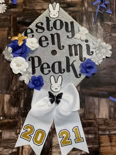 a decorated graduation cap with flowers on it