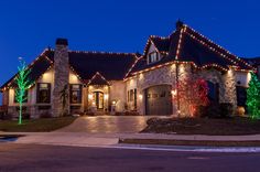 a house with christmas lights on the roof