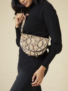 This Vegan Leather Handbag a modern update on the classic messenger, the Ava will instantly elevate your wardrobe. With a unique rounded shape and a trendy embossed-snake print, it will quickly become your new go-to! Comes with a wide shoulder strap and a thin cross-body body strap. Dimensions: Height - 7", Width - 9" Gucci Dionysus, Snake Print, Leather Handbag, Leather Handbags, Cross Body, Vegan Leather, Shoulder Strap, Style Inspiration, Shoulder Bag