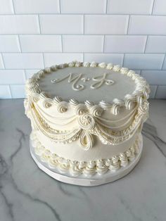 a white cake sitting on top of a counter