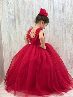 Make your little one's special occasions unforgettable with our stunning Red Baby Girl Dress. Perfect for New Year's celebrations, birthdays, and parties, this handmade dress features exquisite back pearl detailing that adds a touch of elegance and charm. Key Features: Design: Elegant red dress with beautiful back pearl detail, perfect for making a statement at any event. Sizes: Available in various sizes to fit baby girls comfortably. Material: Crafted from high-quality, soft, and breathable fa Red Fitted Gown For Dress-up, Red Sleeveless Princess Dress, Red Ball Gown For Holiday Season, Red Ball Gown For Holiday, Red Ball Gown Dress For Dress-up Occasions, Holiday Red Ball Gown, Red Ball Gown For Dress-up, Red Ball Gown Dresses For Dress-up, Elegant Red Gown For Dress-up