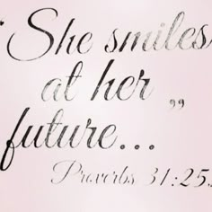 the word she smiles at her future is written in cursive writing