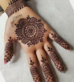 a henna tattoo on someone's hand