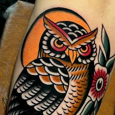 an owl tattoo on the leg