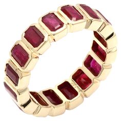 Ruby eternity band ring in 14K gold symbolizes the everlasting love between a couple. It shows the infinite love you have for your partner. The circular shape represents love which will continue and makes your promises stay forever. This is a perfect July Birthstone Jewelry also perfect Handmade Jewelry, Bridal Shower Gift, Valentine Gift, Gift For Sister, Mother Daughter Gift, Bride To Be Gift, Bridesmaid Gift, Mom Gift, BFF Gift, Best Friend Gift, Anniversary Present, Wife Gift, Gift for Her o Luxury Stackable Ruby Ring For Anniversary, Luxury Stackable Ruby Ring With Round Band, Yellow Gold Emerald Cut Eternity Band For Promise Ring, Luxury Stackable Eternity Band For Promise, Luxury Stackable Promise Eternity Band, Elegant Octagon Ruby Ring As Gift, Fine Jewelry Octagon Stackable Rings, Octagon Halo Rings For Anniversary, Elegant Octagon Ruby Ring For Gift