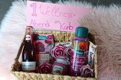 a wicker basket filled with personal care items and a sign that says welcome to albena my korb