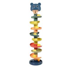 a toy that is sitting on top of a pole with many different colored circles around it