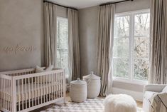 a baby's room is decorated in neutral colors