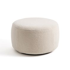 a white ottoman sitting on top of a white floor