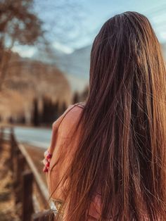 the back of a woman's head with long hair