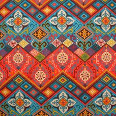 an old, colorful rug with many different patterns