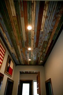 the ceiling is painted with colorful paint and wood planks, along with american flags