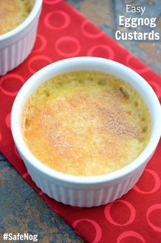 two white bowls filled with food on top of a red place mat