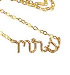 "Mrs lowercase classy script necklace. Made from 14k gold filled wire and chain. The model wears a 16\" necklace. What is 14k gold filled? It is 14k solid gold heat bonded to brass. The coating of gold is 1000x thicker than gold plated. It can last a lifetime if cared for properly. Care instructions will be included. Have questions? Concerns? I'd love to chat with you! ◊◊ Message me on Etsy convo here: https://www.etsy.com/conversations/new?with_id=7293349 OR email me at: aziza [!at] azizajewelry.com ◊◊ Stay a while, keep shopping: http://www.etsy.com/shop/AzizaJewelry ◊◊ Shipping:  Standard Shipping within the US is via USPS First Class Mail, ships within 3-5 days and can take 7-10 business days to arrive  ◊◊ RUSH Priority Mail ships within 1-2 business days and takes 3-5 days to arrive ◊ Elegant Gold Name Necklace For Wedding Gift, Gold Wedding Name Necklace With Adjustable Chain, Dainty Gold Name Necklace For Wedding, Dainty Name Necklace For Wedding And Valentine's Day, Elegant Name Necklace For Wedding And Mother's Day Gift, 14k Gold Charm Necklaces For Wedding And Mother's Day, Custom Name Gold Necklaces For Wedding, Gold Name Necklace For Bridesmaid Gift, Gold Name Necklace For Wedding