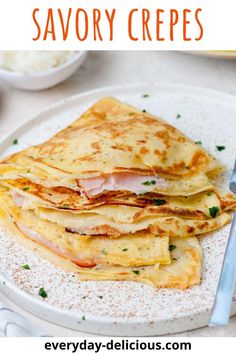 a white plate topped with quesadillas covered in cheese