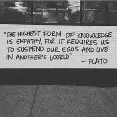 a sign on the side of a building that says, the highest form of knowledge is empty for it requires us to spend our eggs and live in another world