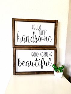 two wooden signs that say hello there handsome and good morning beautiful on a white table