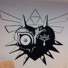 a black and white drawing on a wall with the words majora's mask