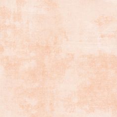 an orange and white background with some stains