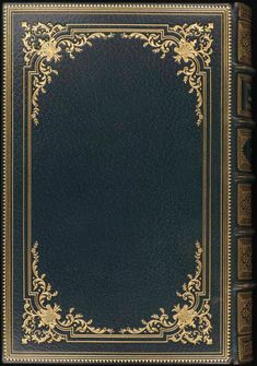 an old book with gold trimmings on the cover and a black leather background