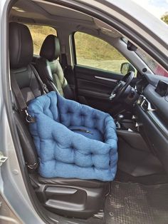 a dog bed in the back seat of a car