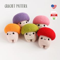 four knitted toy mushrooms with different colors