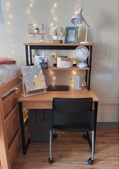 a desk with a chair and shelves on top of it in a room filled with lights