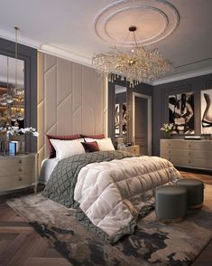 a bedroom with a chandelier hanging from the ceiling and a large bed in front of it