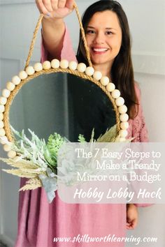 a woman holding a mirror with the words, the 7 easy steps to make a handy mirror on a budget