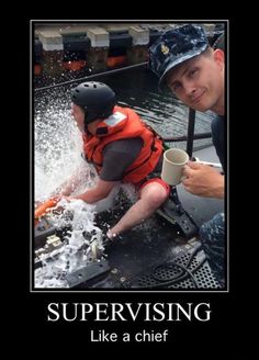 a man and boy in life vests are on a boat with water splashing from it