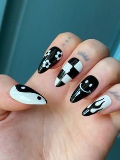 "Hand painted black and white mismatched gel press on nails with yin yang, smile face, floral, flames, checkered design. Nails pictured are STILETTO SHORT shape. PLEASE READ: Use the nail sizing chart instructions from the photos to measure your nails. Then choose from the nail size options XS, S, M, or L. If your nails do not fit the standard sizes and you need custom sizing, please choose \"CUSTOM\" sizing and type in your custom sizes from thumb to pinky (ie. 1, 2, 3, 4, 5) under the \"personalization\" option. Please choose your length and shape. You can find an example of the lengths and shapes I offer in the photos. Keep in mind that choosing a length or shape different from the nail set pictured may result in different print placement and design, based on how much space the nail sha Black Colourful Nails, Simple Cool Nail Designs, Black And Colour Nails, Cute Painted Nail Ideas, Flame And Checkered Nails, Easy Star Nails, Pop Punk Nails, Nail Ideas Stiletto Short, California Nails Designs