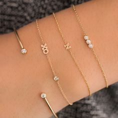 14k gold chain bracelet with a short bar of three bezel set round diamonds SPECIFICS • 14k cable chain adjustable at 6-6.5-7"• round diamonds are approx. 2mm each• white diamonds .09 ctw Diamond Bar Bracelet, Diamond Bracelet Design, Hugs Kisses, Open Cuff Bracelet, Simple Diamonds, Letter Bracelet, Classic Bracelets, Simple Bracelets, Adjustable Bangle