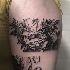 a man's arm with an inked image of a demon on the side