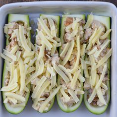 zucchini stuffed with meat and cheese in a baking dish