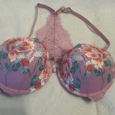 This Beautiful Pink, Floral Embroidered Cups Bra Is From Intimissimi, With Adjustable Halter Satin Straps. There Is A Lovely Pink Lace Insert In The Back Connecting The Top Of The Straps To The Lace Base. This Is A New, Unworn Garment With Tags Attached As It Came Direct From Their Warehouse. It Is Sized 36 C, With Nice Push Up And Padding. The Plastic Closure Is At The Front. Pink Push-up Bra With Lace Closure, Feminine Pink Bra With Lace Closure, Spring Pink Bra With Removable Pads, Feminine Pink Bra With Lined Body, Pink Push-up Bra With Lace Trim, Spring Pink Bra With Lined Body, Feminine Pink Lined Bra, Pink Lined Spring Bra, Spring Pink Lined Bra