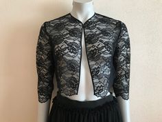 "Bolero Jacket Black Bolero Jacket Lace Bolero Jacket Women's  Women 3/4 Sleeve Bolero Shrug Jacket Measurements (lying flat): Length(back): 16\"/ 40.5 cm Shoulder: 15\"/ 38 cm Pit to pit: 18\"/ 46 cm Sleeve: 16.5\"/ 42 cm Please check measurements to insure a proper fit. Remember to allow yourself some extra room for movement. You can compare these with something from your closet that fits you well. Condition: great Vintage Condition SHIPPING * I ship worldwide via Priority mail  * Items are shipped 1 - 3 business days after receiving the payment. * I ship from Europe, so please allow 2 to 4 weeks for the package to arrive if you live overseas. * Europe 5 - 10 business days.  BK 8" Fall Party Outerwear With 3/4 Sleeves, Fitted 3/4 Sleeve Shrug For Fall, Fitted Fall Outerwear With 3/4 Sleeve, Black Bolero Jacket, Lace Bolero Jacket, Black Bolero, Shrug Jacket, Sleeve Bolero, Lace Bolero