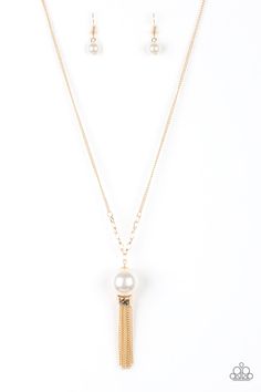 A dramatic pearly white bead swings from the bottom of an elegantly elongated gold chain. Featuring a hammered fitting, a gold tassel streams from the bottom of the colorful pendant for a refined finish. Features an adjustable clasp closure.

Sold as one individual necklace. Includes one pair of matching earrings. Ballroom Necklace, Bling Party, Gold Tassel Necklace, Nickel Free Jewelry, Gold Long Necklace, Paparazzi Accessories, Paparazzi Jewelry, White Beads, Necklace Earring Set