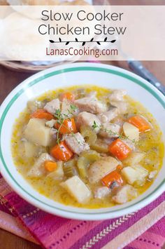 a bowl of chicken stew with carrots and potatoes