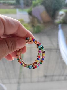 Multicolored crystal beads meticulously wire wrapped over gold hoop earrings. Doll Jewelry, Gold Hoop, Gold Hoop Earrings, Crystal Beads, Wire Wrapped, Wire Wrapping, Doll Toys, Doll Clothes, Etsy Earrings