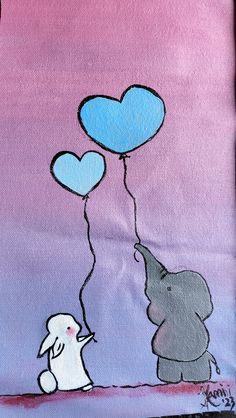 an elephant holding two heart shaped balloons in the air with another elephant standing next to it