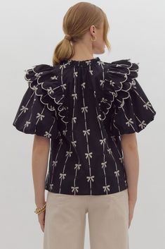 True to size, I am an 8/10 wearing a medium. 100% cotton bow print short puff sleeve v-neck top featuring tiered scallop ruffles at shoulders. Self-tie detail at ruffled neckline. Unlined, woven, non-sheer, lightweight. Small 4-6Medium 8-10Large 12-14 Bow Print, Short Puff Sleeve, Ruffled Neckline, Bow Blouse, White Bow, V Neck Tops, Dress Accessories, Printed Shorts, Puff Sleeve