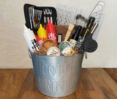 a metal bucket filled with lots of different items