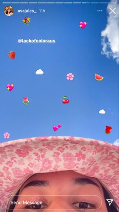 a woman wearing a pink hat and looking up at the sky with hearts flying above her